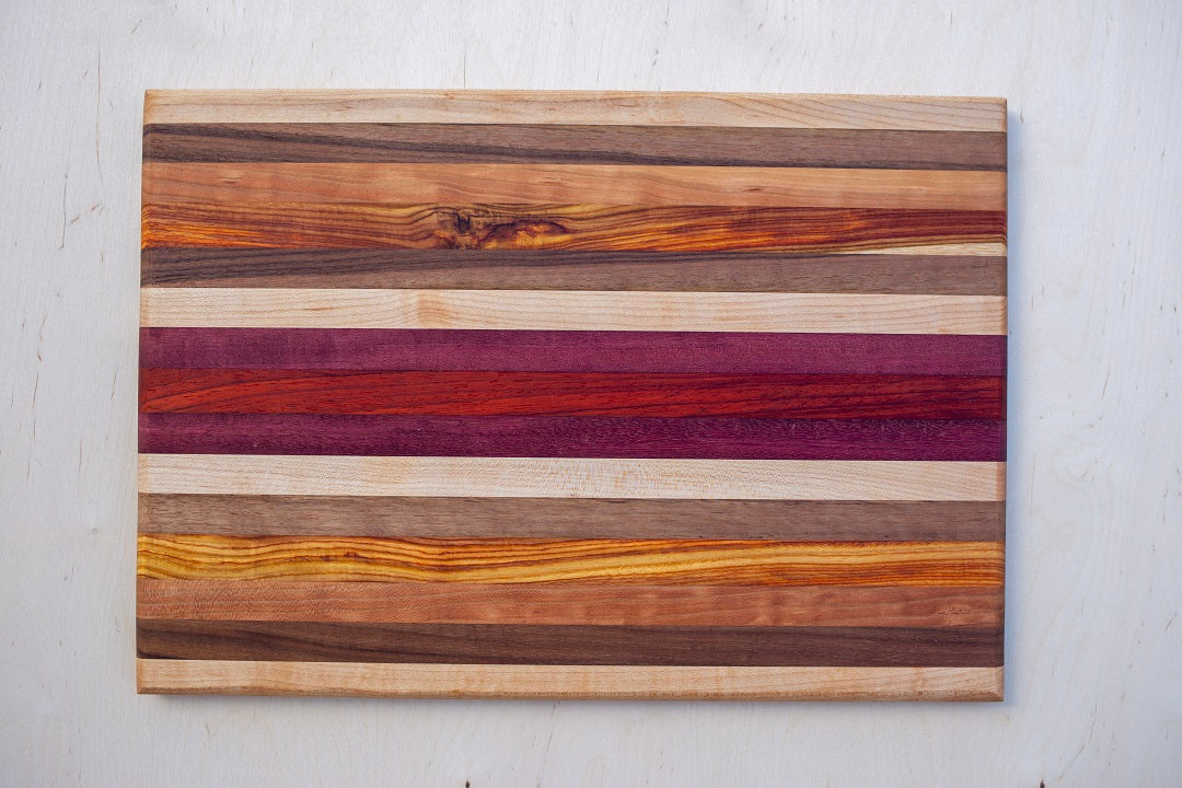 Edge grain cutting or serving board mixed exotic and domestic hardwoods