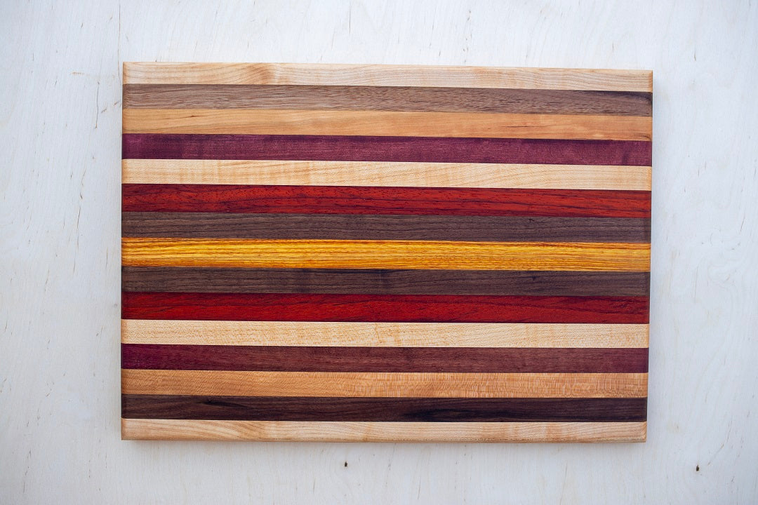 12.5x18x.75- Edge grain cutting or serving board mixed exotic and domestic hardwoods
