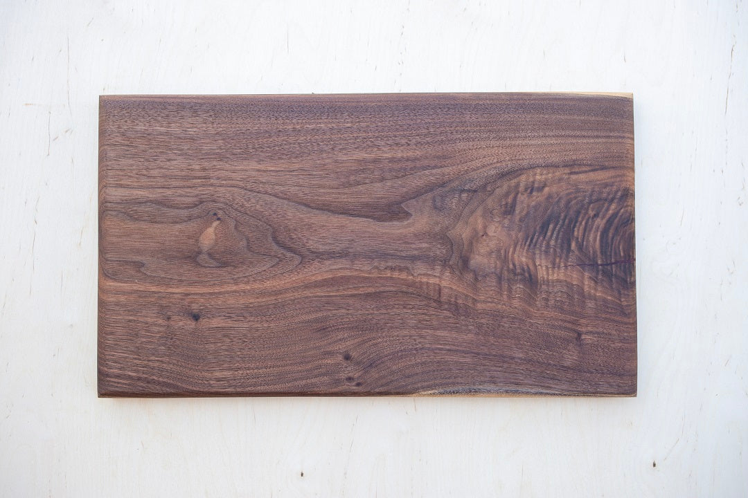 10x19x.75- Walnut live edge board with red epoxy accent