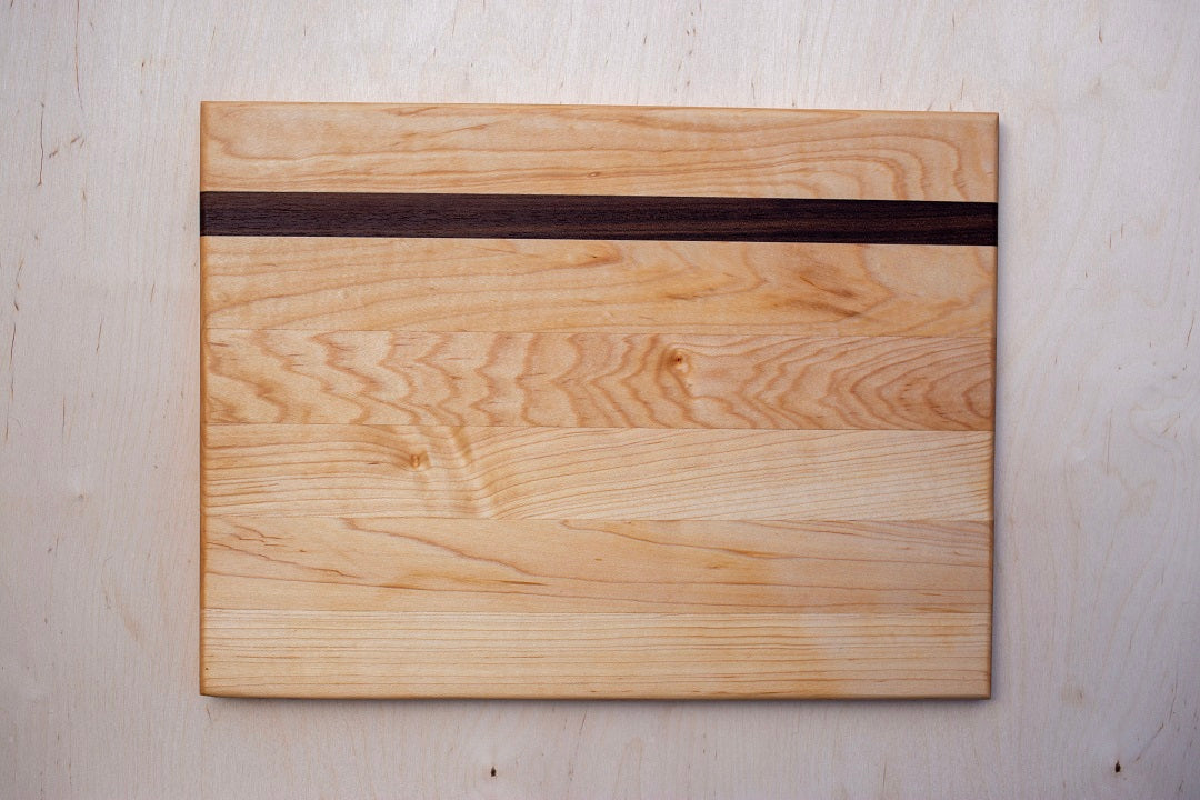 Edge grain maple board with walnut accent strip