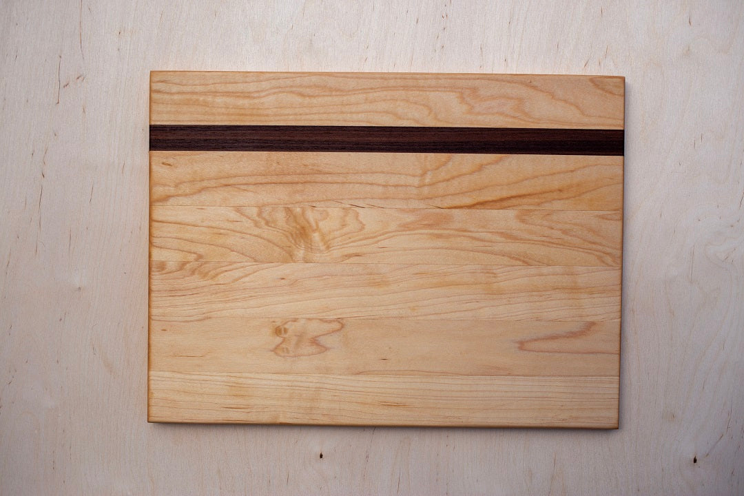 Edge grain maple board with walnut accent strip