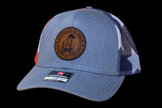 American by birth. Patriot by choice leatherette patch with hat