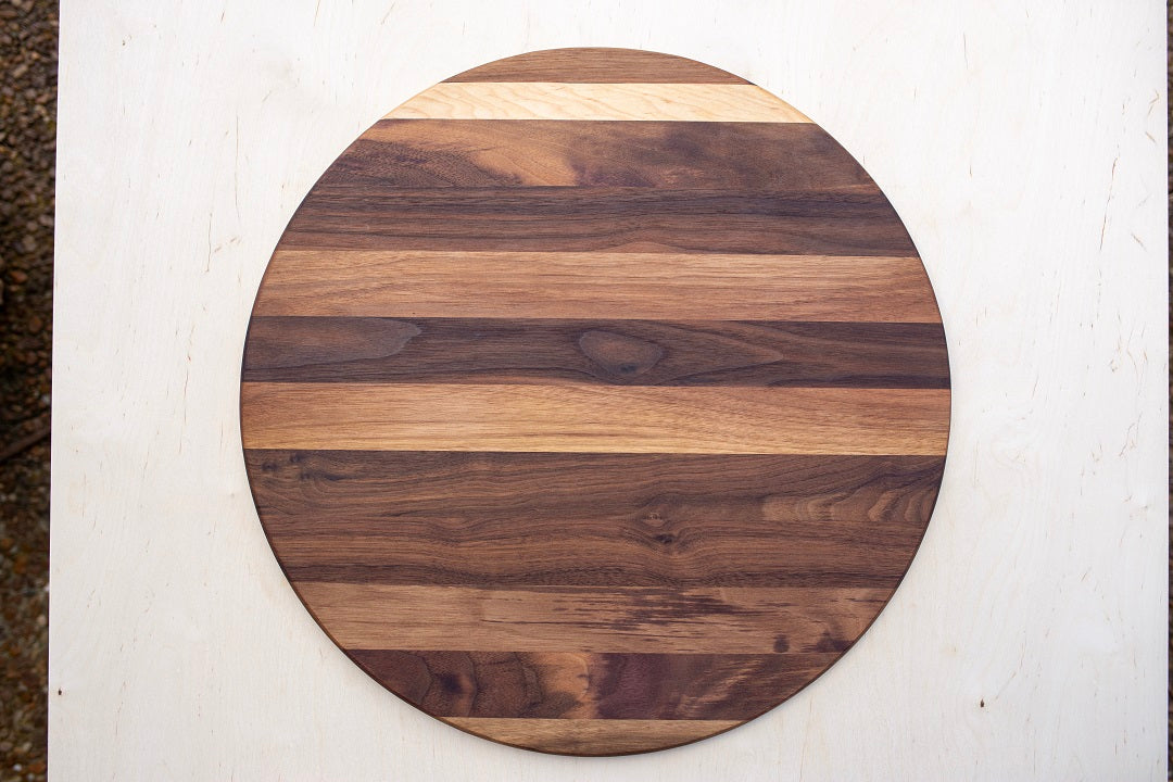 18” circle x.75- Edge grain walnut with maple accent strip